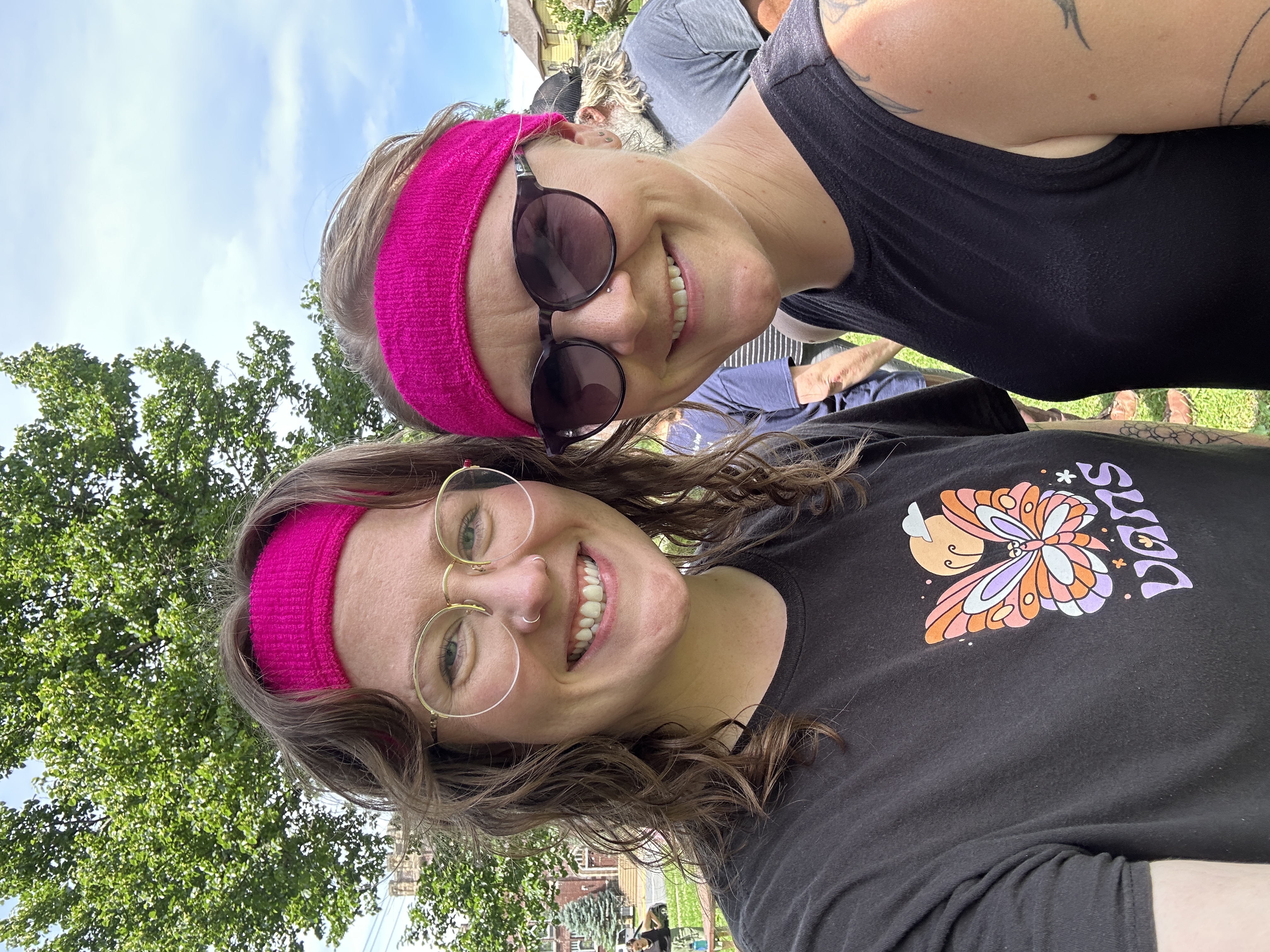 people smiling with pink sweatbands